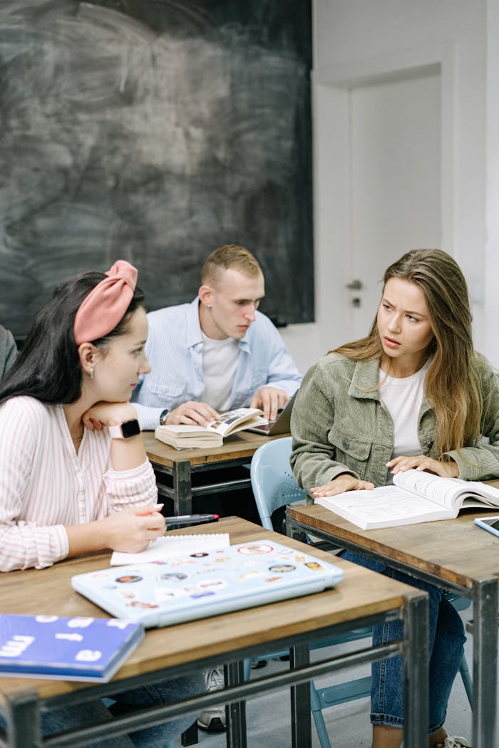 High school students actively engaged in a thoughtful classroom discussion.